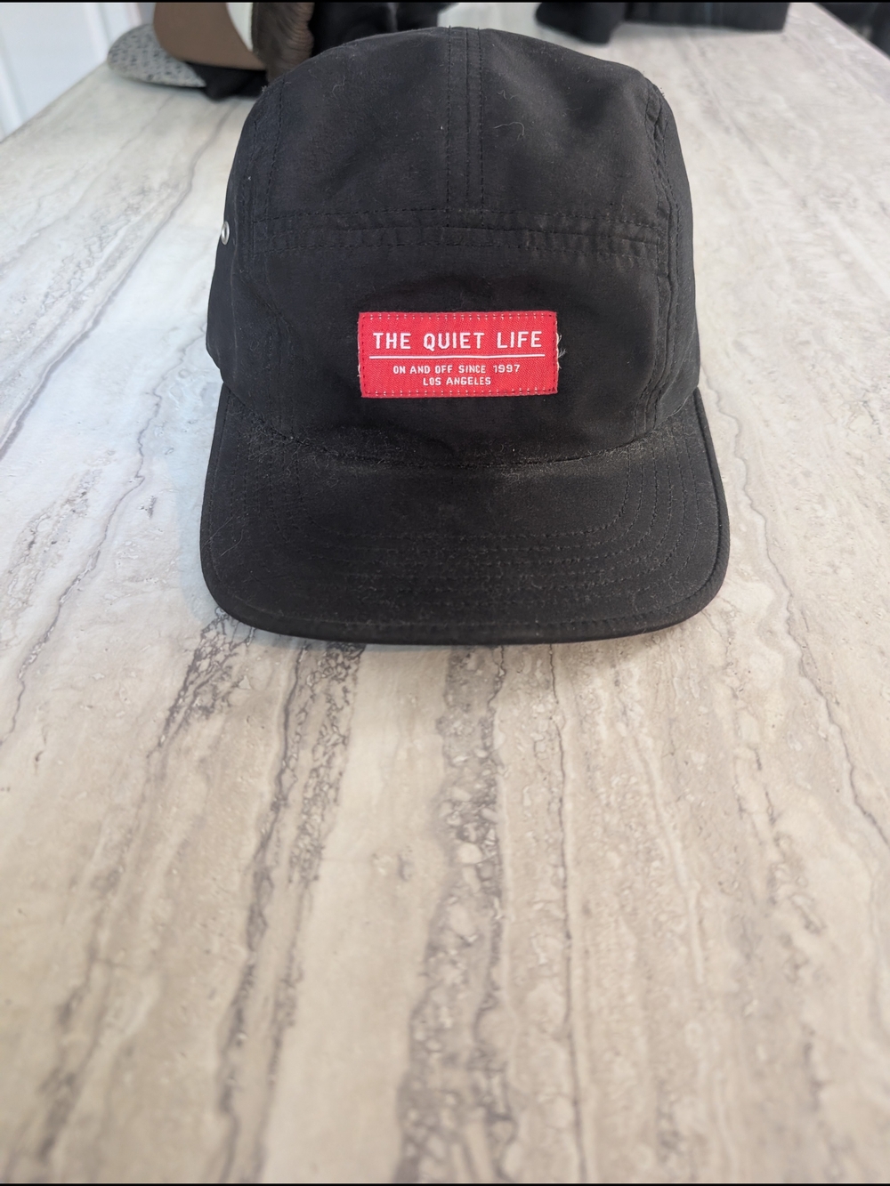 Black Five-Panel Cap with Red Logo Patch